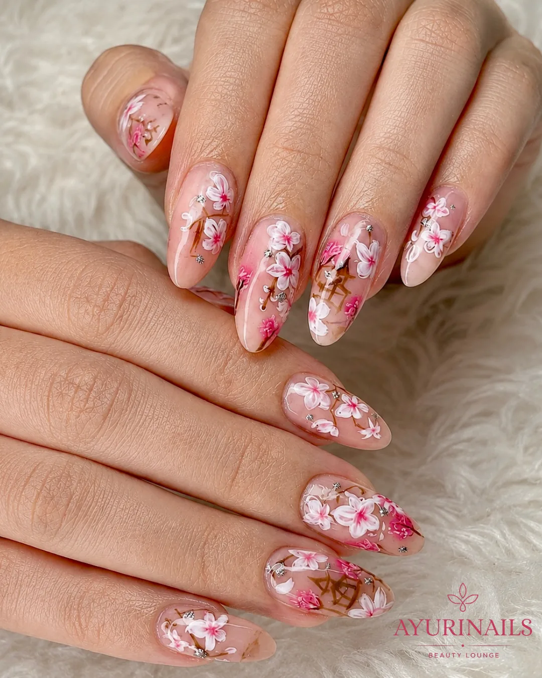 hand-painted cherry blossom sakura nail art with rhinestones on nude almond nails, AyuriNails Beauty Lounge Makati